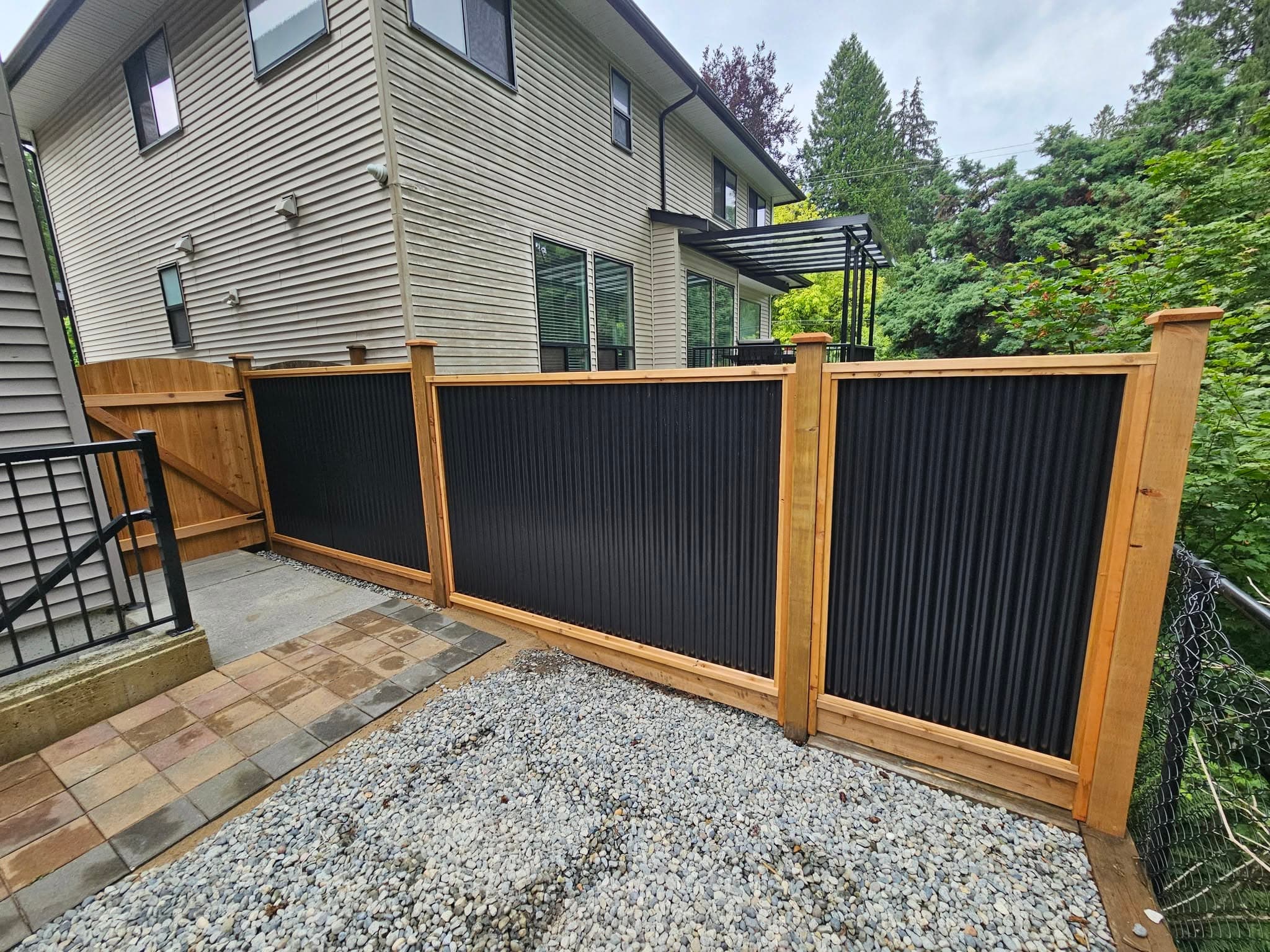 Corrugated metal and cedar trim fence with new gate, Maple Ridge, BC